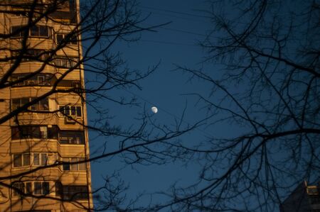 moon in the evening against a clear sky, Moscowの写真素材