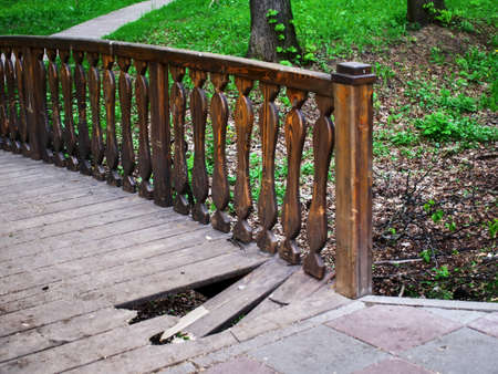 broken bridge in the park in springの写真素材