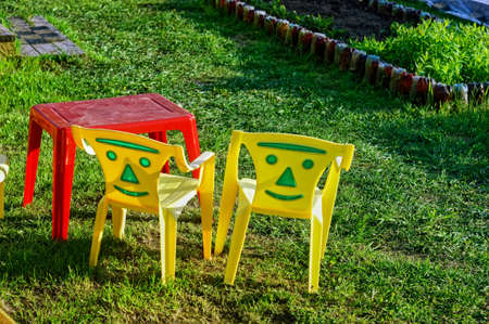 children's plastic furniture in the garden, springの写真素材