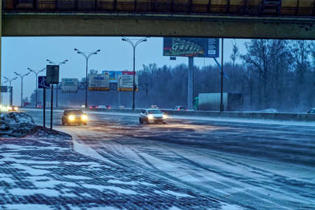 snow blizzard on the road in the early morning, Moscow