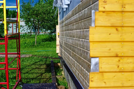 finishing of the exterior wall of the village house, in summerの写真素材