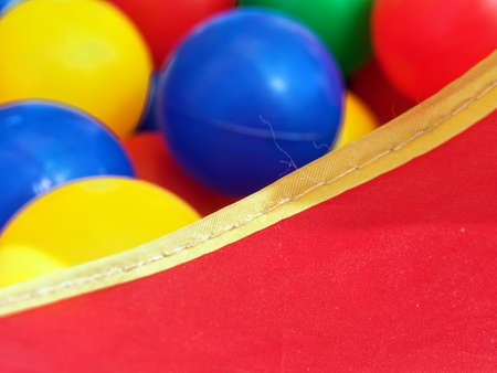 colorful plastic balls lie in a box, macroの写真素材