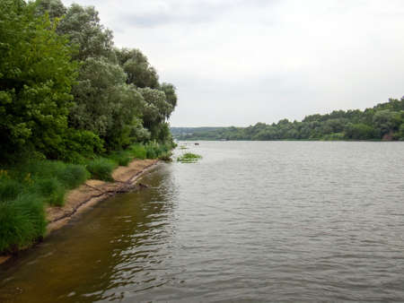 river bank on a cloudy day, in summerの写真素材