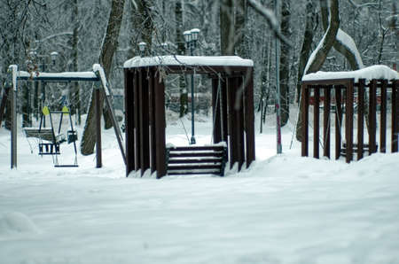 children's playground in the park, in winter