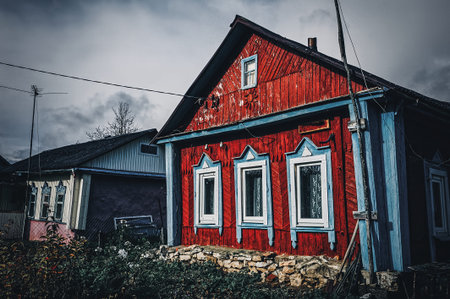 old wooden house in the village in autumn, Russiaの写真素材