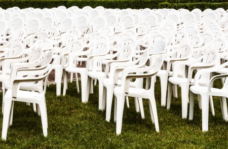 White chairs set up for open air concertの写真素材