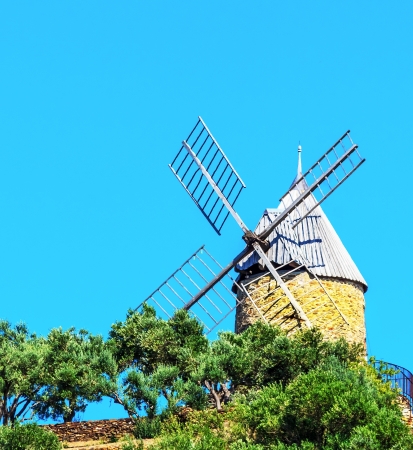 Old windmill in the pine groveの写真素材