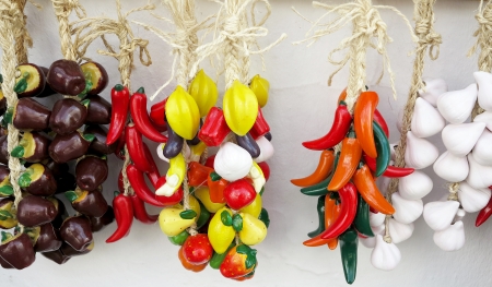 Colorful deco ceramic fruit and vegetables on white wall