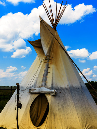 Indian Tepee Tent and cloudy blue sky