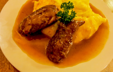 Beef olives with potato puree on the plateの写真素材