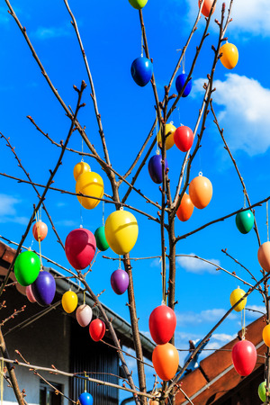 Colorful Easter eggs on blue skyの写真素材