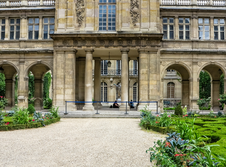 Paris- The MusÃ © e Carnavalet. Patio with beautiful ornate gardens. The museum which opened in 1880 and is dedicated to the history of Paris, from its origins to the present dayのeditorial素材