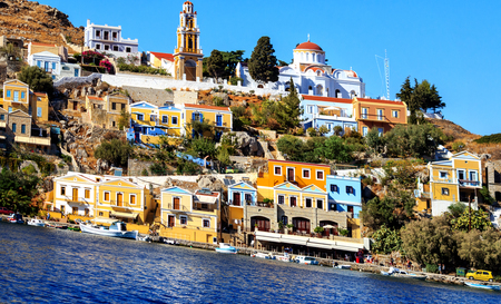 Picturesque colorful houses and monastery Panormitis on the Greek Iceland of Symi