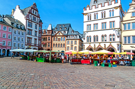 TRIER, GERMANY-MAY 15, 2018: Picturesque iconic Market square, the Main Market, shaped through the centuries, is one of the most beautiful old german market squares in Trier, the oldest german city, and the favorite residence of roman emperors.のeditorial素材