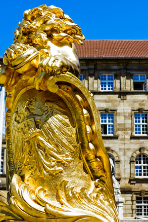 KASSEL, GERMANY-JUNE 14, 2017: Kassel's grand town hall, fronted by two striking golden lions, was inaugurated in 1909, with the front section largely rebuilt after the.のeditorial素材