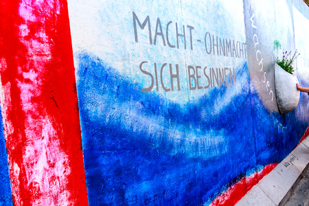 BERLIN, GERMANY - July 27, 2018: Graffiti art on original section of Berlin Wall at East Side Gallery in Friedrichshain.のeditorial素材