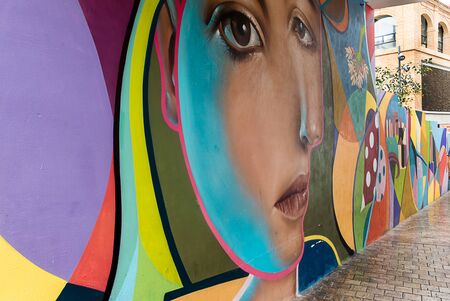 MALAGA, SPAIN- SEPTEMBER 28, 2018: Graffiti by artist Belin in the Jewish quarter (Plaza de la Juderia)のeditorial素材