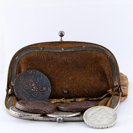 Old leather purse with silver coins of tsars of House of Romanovs of 18-19 centuries.の写真素材