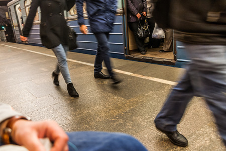 the arrived passengers of the subway hurry on change or an exit to the cityの写真素材