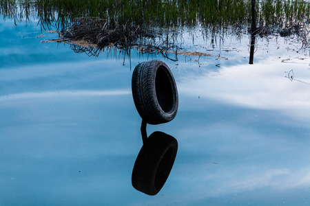 the second life of a car tire as the buffer for the boatの写真素材