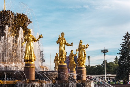 Moscow, Russia - October 4, 2015: Part of the Exhibition Centre VDNH (VVC), Moscow, Russia. The "Friendship of the People" fountain at an exhibition. In an image of gold girls 15 republics of the USSR are stylized.のeditorial素材