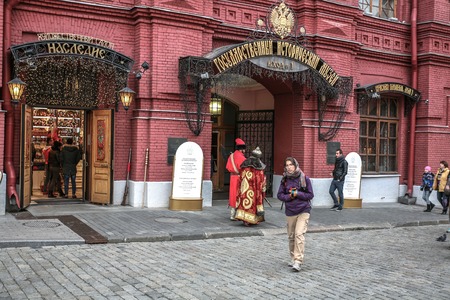 Moscow, Russia - October 14, 2015: Moscow Kremlin and Red Square. Entrance to the State Historical Museum (GIM). The tsar walks with the soldier, attracting tourists.のeditorial素材
