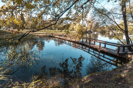 the wooden bridge  to the middle of the riverの写真素材