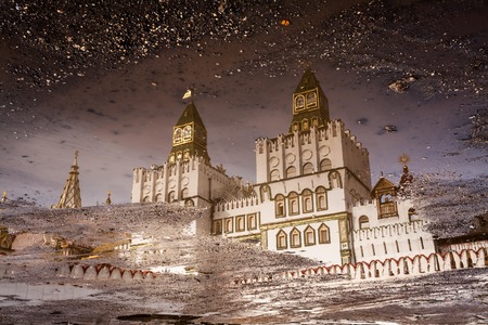Reflection of the Izmaylovsky Kremlin in a dirty spring pool