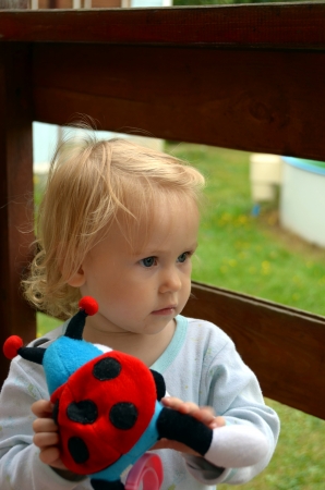 Little Baby girl with a toy.の写真素材