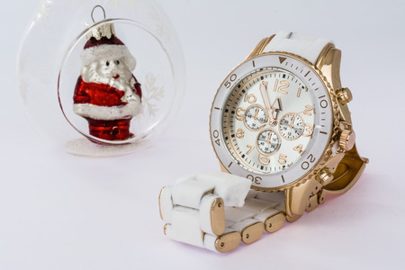 White women's watches and Christmas Toy Father Frost on a white backgroundの写真素材