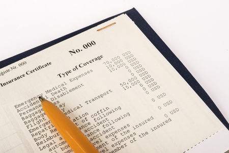 Health insurance policy blank and orange pen on table close upの写真素材