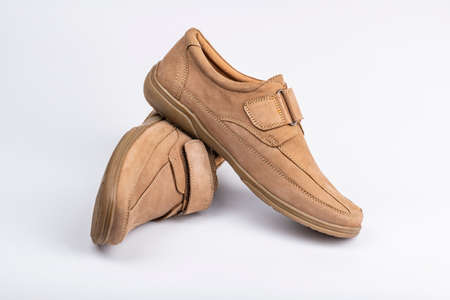 Beige men's summer leather shoes slipper on white backgroundの写真素材