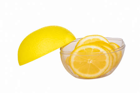 Capacity for the lemon with a yellow lid and sliced lemon insideの写真素材
