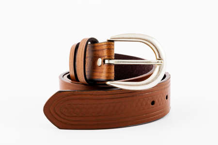 Brown leather men's belt on a white backgroundの写真素材