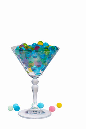 Vermouth glass and water balls for cooling drinks. On white background - isolateの写真素材
