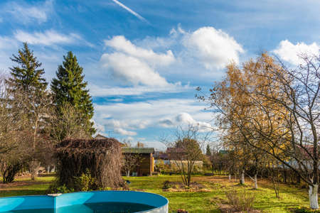 Autumn garden in front of a country houseの写真素材