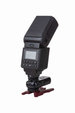 Black camera flash with radio synchronizer and desktop standの写真素材