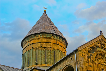 Dome of the Georgian church against the background of the evening sky