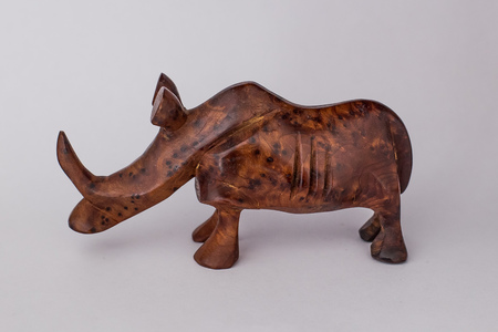 Wooden figurine on a white background, rhinocerosの写真素材