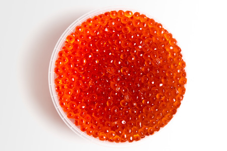 red caviar salmon in a jar on a white backgroundの写真素材