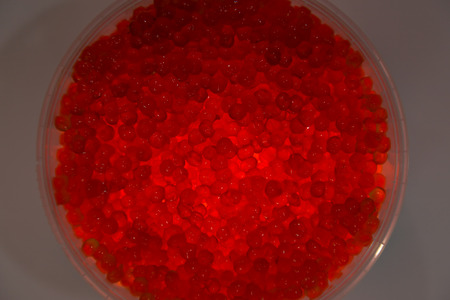 red caviar salmon in a jar on a white background