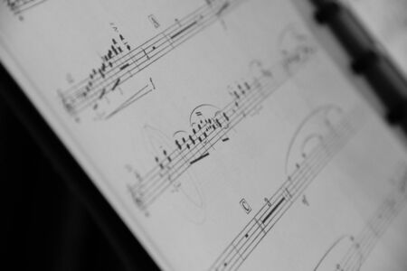 BRECHT/BELGIUM - FEBRUARY 6 2018: A portrait of a music sheet partly blurred and partly sharp giving it an artistic feel.のeditorial素材
