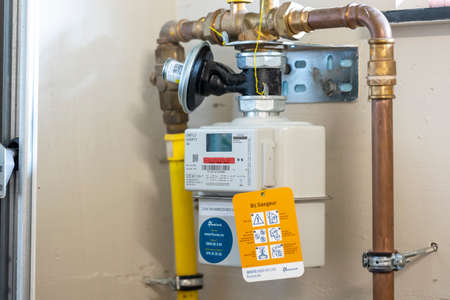 Brecht, Belgium - October 1 2021: A portrait of a newly installed digital Belgian gas meter. This way the provider can read the smart measuring device remotely.のeditorial素材