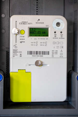 Brecht, Belgium - October 1: Portrait of a newly installed Belgian digital electricity kilowatt hour meter. The measurement device is used by the provider to calculate the correct bill for the customer.のeditorial素材