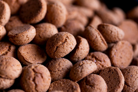 A portrait of a pile of traditional Dutch treats called Pepernoten or Pepernuts. The gingerbread...
