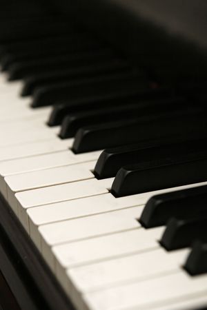 vertical image of piano keys at an angle.  Shallow DOF.