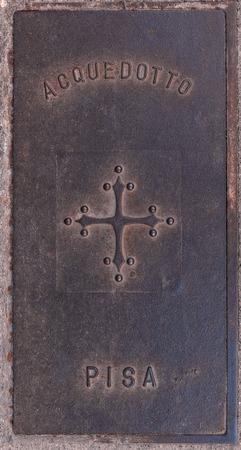 Old manhole cover. Pisa Tuscany Italyの写真素材