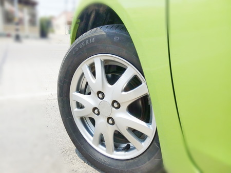 Focusing on the car's wheels turning.の写真素材