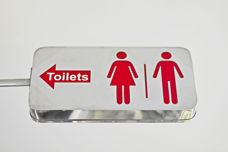 Metal label located in a public bathroom.の写真素材