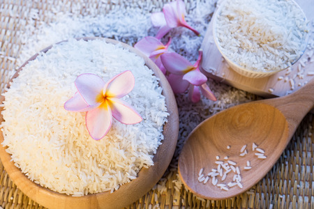 Rice in wooden bowl and spoonの写真素材